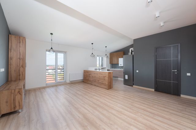 empty apartment open plan kitchen and living area